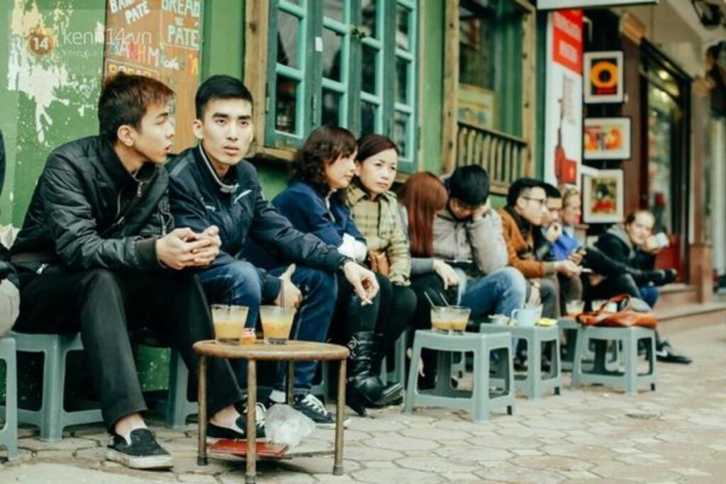 Sidewalk coffee with plastic stools at a Vietnamese café