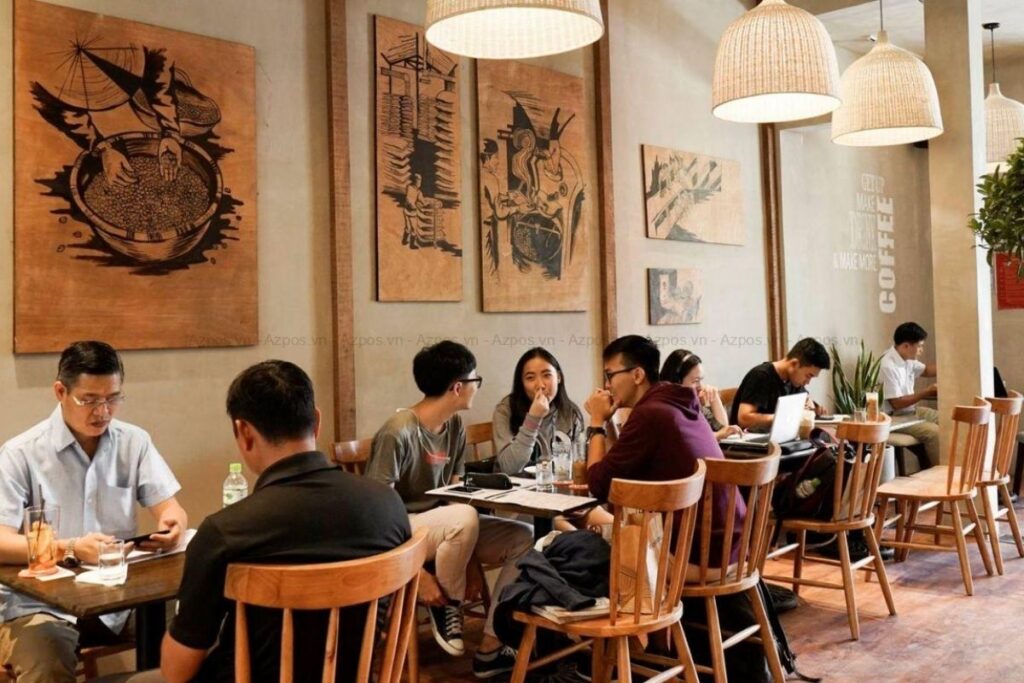 Customers sitting and using a café in Vietnam
